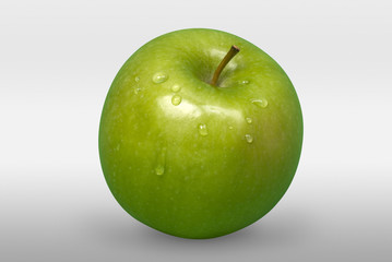 Green apple with water drops on white background. Front view.
