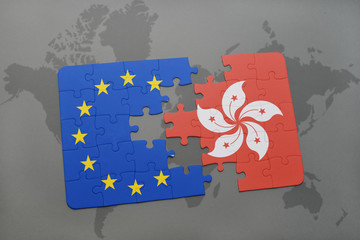 puzzle with the national flag of hong kong and european union on a world map background.
