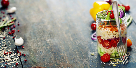Cucumber, quinoa, tomato, onion, carrot and mint salad in a jar