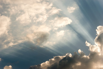 Sun breaking casting beams trough the beautiful cloudscape