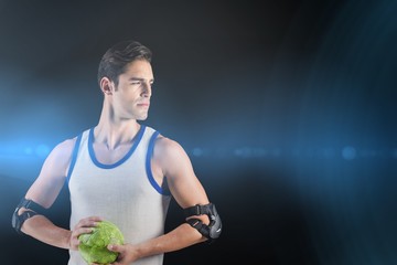 Composite image of confident athlete man holding a ball  © vectorfusionart