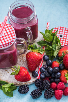 fresh berries smoothie in jars