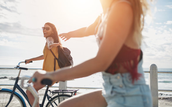 Two friends out for a bike ride on sunny day