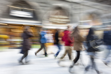 A shopper walking against shop window, shopping spree