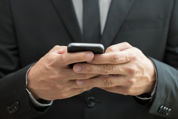 Businessman using mobile smartphone