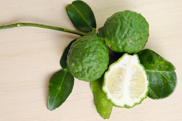 Bergamots fruit with leaf on wooden board