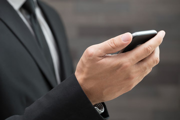 Businessman using mobile smartphone