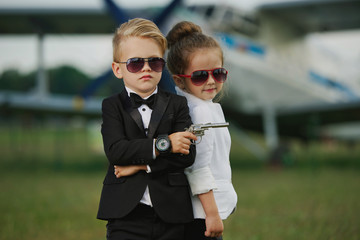 young boy and girl playing spy