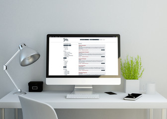 modern clean workspace with job search website on screen