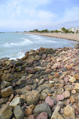 Fototapeta na wymiar playa con piedras grandes en el grau de moncofa castellon valencia