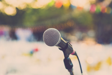 Microphone on outdoor stage. Vintage filter