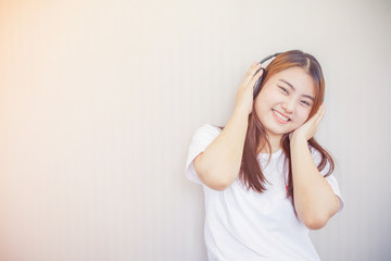 asian young woman enjoying with her music listening