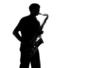 silhouette of a man playing the sax