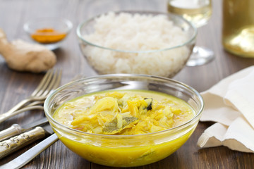fish curry in bowl and boiled rice