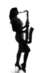 young woman playing the saxophone