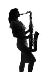 silhouette of a woman with a saxophone