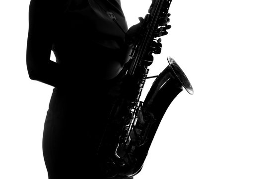 silhouette of a woman with a saxophone