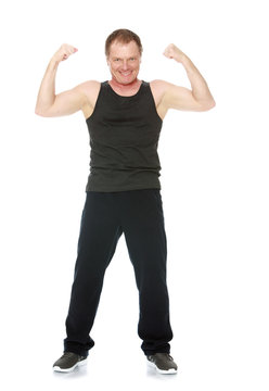 A 50 Year Old Man Does Morning Exercises-Isolated On White Background