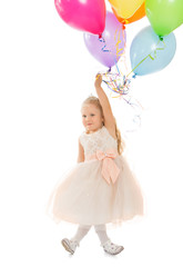 Fototapeta na wymiar Funny little girl in fancy white dress holding a balloons - Isolated on white background