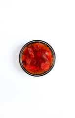 Strawberry jam on a white background from above