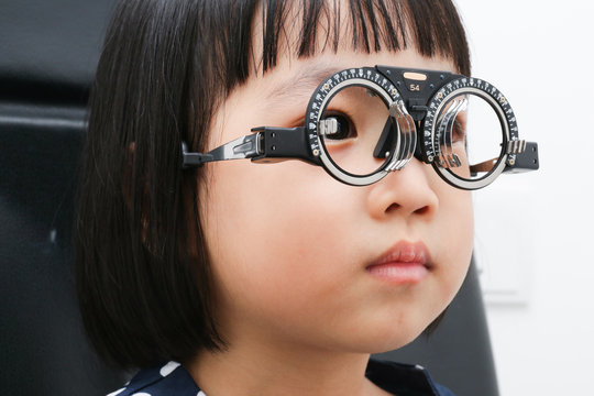 Asian Little Chinese Girl Doing Eyes Examination