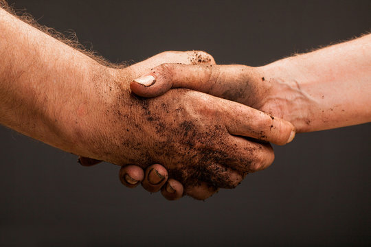 Farmers  Hand Holding Soil Surface