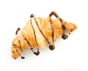 fresh croissant with hot chocolate on a white background. Top view.