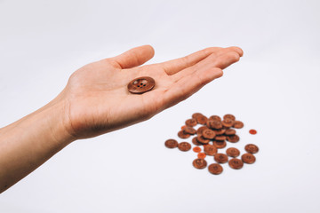 sewing a button in hand