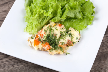 Meat covered cheese and tomato