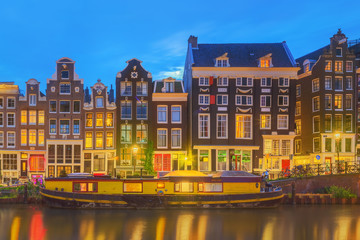Obraz premium Amstel river, canals and night view of beautiful Amsterdam city. Netherlands.