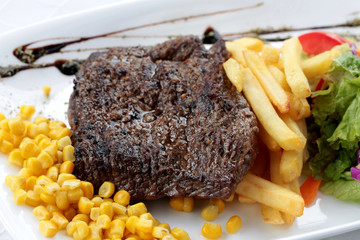 Beef steak, grilled with vegetables, fresh and juicy, close up