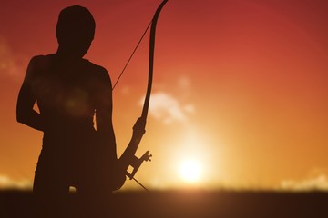 Composite image of athletic woman practicing archery