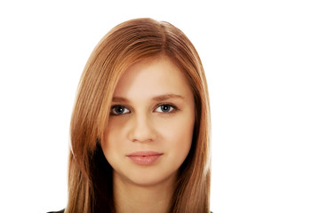 Naklejka premium Pretty teenager girl smiling in cheerful mood