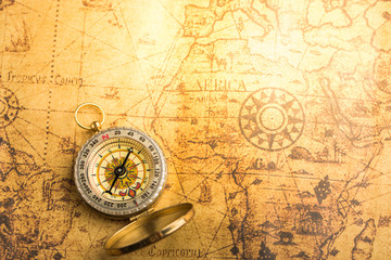 Fototapeta na wymiar Compass on vintage map
