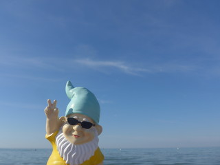 Garden gnome on vacation at sea 