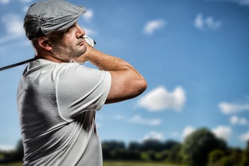 Composite image of portrait of golf player taking a shot