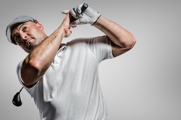 Composite image of portrait of golf player taking a shot