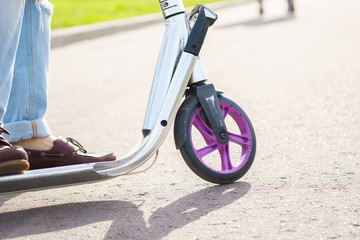 Closeup view with legs on scooter