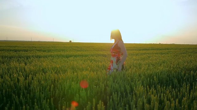girl in a field smiling emotions hands dancing ears laughs runs listening to music girl portrait sun beautiful sunset light dress posing road smile mystery