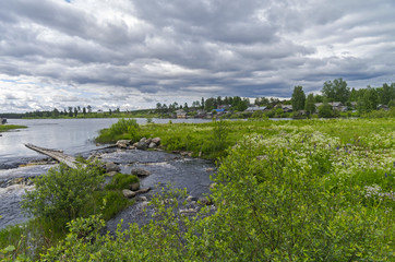 Obraz premium The village by the river