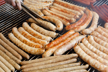 Street fast food, grilled sausages at bbq