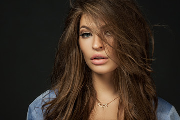 Fototapeta premium close up portrait of a beautiful girl with a voluminous hair and