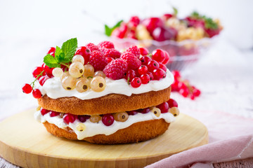 Obraz na płótnie Canvas Berries and cream sponge layer cake