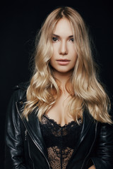 close-up portrait of a young girl. sexy girl on a black backgrou