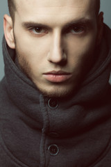 Male beauty concept. Portrait of brutal young man with short hair