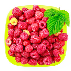 Bowl full of ripe raspberries isolated on white background.