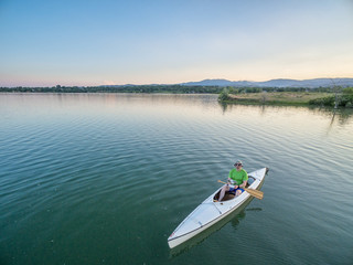 Fototapeta na wymiar operating drone from canoe