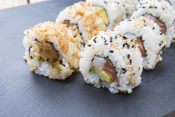 Sushi rolls on a slate plate