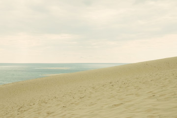 Fototapeta na wymiar Sand, sea and sky