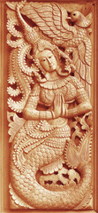  Traditional Old wood carving on the wall of Temple in Thailand,